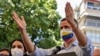 Opposition leader Juan Guaido, wearing a face mask depicting the Venezuelan flag, gestures while speaking during a press conference at Los Palos Grandes square in the Chacao neighborhood, Caracas on May 12, 2021. (Photo by Yuri CORTEZ / AFP)