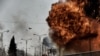 FILE - Fire and smoke billow following a car bomb explosion as Iraqi forces clash with Islamic State (IS) group fighters in Mosul on March 5, 2017.