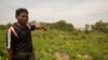 អ្នក​ភូមិ​ទួល​វិហារ​ លោក តេង ពៅ អាយុ​៥៣​ឆ្នាំ បង្ហាញ​ជ្រលង​នៅ​ក្បែរ​ចម្ការ​របស់​លោក ដែល​លោក​សង្ស័យ​ថា​ជា​កន្លែង​សំបូរ​ទៅ​ដោយ​គ្រាប់​បែក​មិន​ទាន់​ផ្ទុះ​ ដែល​ត្រូវបាន​ទម្លាក់​ដោយ​សហរដ្ឋអាមេរិក​កាលពី​អំឡុង​ទសវត្សរ៍​ឆ្នាំ​១៩៧០។ (ស៊ុន ណារិន/VOA)