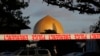 A police officer stands guard in front of the Al Noor Mosque in Christchurch, New Zealand, March 17, 2019, where one of the two mass shootings occurred.