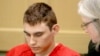 FILE - Nikolas Cruz, accused of killing 17 people at a Florida high school, appears in court for a status hearing in Fort Lauderdale, Florida., Feb. 19, 2018. Cruz was formally charged March 7 with 17 counts of premeditated murder and another 17 counts of attempted murder.
