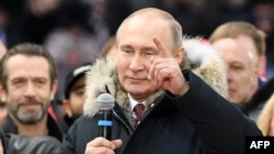 Le président russe Vladimir Poutine lors d'un rassemblement de campagne au stade Luzhniki, Moscou, 3 mars 2018.