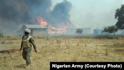 Photo d'archives: Présence de soldats nigérians après avoir chassé des combattants de Boko Haram d'un village près de la forêt de Sambisa touchant l'Etat de Borno.
