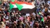 Sudanese protesters and wave flags during a rally at the Green Square in Khartoum, Sudan, July 18, 2019. 