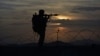 FILE - A Pakistani border security guard stands alert at Pakistan-Afghanistan border post, Chaman in Pakistan, May 5, 2017. The U.S. recently decided to withhold $50 million in military aid to Pakistan for failing to do enough against the Haqqani network.
