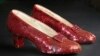 FILE - Sequin-covered ruby slippers worn by Judy Garland in 'The Wizard of Oz' appear at the offices of Profiles in History in Calabasas, Calif. on Nov. 9, 2001.