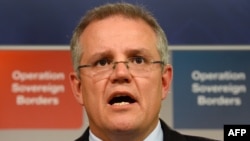 FILE - Australian Immigration Minister Scott Morrison speaks during a press conference in Sydney.