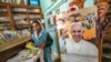 A nun shops in a store offering Pope paraphernalia in Antananarivo, Mozambique, Sept. 3, 2019.