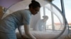 Nurses set up a mosquito tent over a hospital bed, as part of a precautionary protocol for patients who are infected by Zika at Farrer Park Hospital in Singapore Sept. 2, 2016