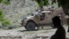 FILE - U.S. forces and Afghan commandos are seen in Asad Khil village in the Achin district of Jalalabad, Nangarhar province, Afghanistan, April 17, 2017.