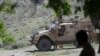 FILE - U.S. forces and Afghan commandos are seen in Asad Khil village in the Achin district of Jalalabad, Nangarhar province, Afghanistan, April 17, 2017. Iran accuses the United States of aiding Islamic State in Afghanistn, charges Washington vehemently denies.