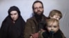 In this still image taken from a December 2016 video released by the Afghan Taliban, U.S. national Caitlan Coleman and her Canadian husband, Joshua Boyle read a statement urging then-President-elect Donald Trump to negotiate to secure their release.