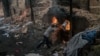 A worker loads bricks into a kiln at a brick factory in Kandal Province.