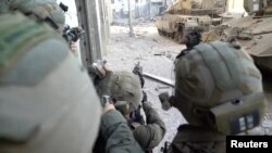 Soldiers of Israel's Paratroopers Brigade take part in an operation at a location given as Gaza