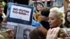 FILE - Yulia Navalnaya, widow of the late Kremlin critic Alexey Navalny, attends a rally near the Russian embassy in Berlin. March 17, 2024. Accusing Navalnaya of participating in the activities of an "extremist" group, a Russian court on July 9 ordered her arrest in absentia.