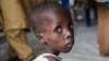 A boy suffering from severe acute malnutrition sits at one of the UNICEF nutrition clinics, in the Muna informal settlement, which houses nearly 16,000 IDPs (internally displaced people) in the outskirts of Maiduguri capital of Borno State, northeastern N