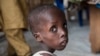 FILE - A boy suffering from severe acute malnutrition sits at one of the UNICEF nutrition clinics, in the Muna informal settlement, which houses nearly 16,000 IDPs (internally displaced people) in the outskirts of Maiduguri capital of Borno State, northeastern Nigeria.