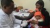 FILE - Teams are trying to teach Cameroonians how to protect themselves from malaria by systematically using insecticide-treated mosquito bed nets.