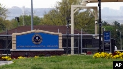 FILE - The gate for the Joint Base Anacostia-Bolling is seen in Washington, D.C., April 17, 2013. The base was one of the Washington-area sites that received suspicious packages Monday.