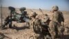 FILE - U.S. soldiers ready a howitzer to be towed into position at Bost Airfield in Afghanistan's Helmand Province in this June 10, 2017 photo provided by Operation Resolute Support. The U.S. and NATO deny Iranian allegations that U.S. troops in Afghanistan support Islamic State militants.