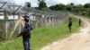 FILE - Myanmar border guards provide security near the fence at a no-man's land between Myanmar and Bangladesh, near Taungpyolatyar village, Maungdaw, northern Rakhine state, June 29, 2018. The Arakan Army claimed, Dec. 8, 2024, the capture of the last army outpost in Maungdaw.