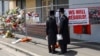 FILE - People gather outside the fire damaged Adass Israel Synagogue in Melbourne, Monday, Dec. 9, 2024. 