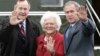 U.S. President George W. Bush (R) waves alongside his parents, former President George Bush and former first lady Barbara Bush upon their arrival Fort Hood, Texas, April 8, 2007. 