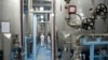 FILE - A technician is seen at the uranium conversion facility in Isfahan, 450 kilometers south of Tehran, Feb. 3, 2007. The Isfahan nuclear research center is already home to three reactors.