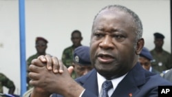 Ivory Coast's President Laurent Gbagbo attends an official funeral ceremony in Abidjan in this November 15, 2003 file photo. Ivory Coast's incumbent leader Laurent Gbagbo has been arrested, a spokeswoman for forces loyal to his rival presidential claimant