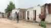 FILE - Houses destroyed during battles with Boko Haram are seen in Kousseri, Cameroon, June 11, 2019. Dozens of people have fled their villages after a suicide bombing April 5, 2020, reignited fears of infiltration by Boko Haram terrorists.