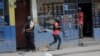 Police patrol the streets after gang members tried to attack a police station, in Port-au-Prince