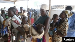 FILE - Women who fled fighting in South Sudan arrive at Bidi Bidi refugee’s resettlement camp in northern Uganda, Dec. 7, 2016.