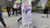 A reward poster hangs on a light pole outside the New York Hilton Midtown Hotel in New York on Dec. 5, 2024, where Brian Thompson, the CEO of UnitedHealthcare, was fatally shot on Wednesday.