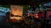 A mobile food vender waits for customers in Bangkok, Thailand, June 9, 2020. Thai government continues to ease restrictions on businesses that were imposed weeks ago to combat the spread of COVID-19.