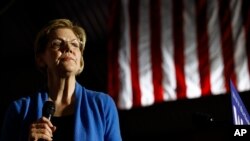 Democratic presidential candidate Sen. Elizabeth Warren, D-Mass., waves to supporters and volunteers, Feb. 29, 2020, in Columbia, S.C.