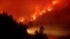 FILE - The Delta Fire burns in the Shasta-Trinity National Forest, California, Sept. 6, 2018. 