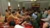 မြန်မာအစိုးရ စေ့စပ်ညှိနှိုင်းရေးအဖွဲ့နဲ့ ရှမ်းလက်နက်ကိုင်တပ်ဖွဲ့တို့ကြား ၂၀၁၂ ခုနှစ်က ရွှေတြိဂံနယ်မြေအတွင်း၊ ကန်တောင်မှာ နှစ်ဘက် စာရွက်စာတမ်းများလဲလှယ်အပြီး အပြန်အလှန် လက်ဆွဲနှုတ်ဆက်နေကြစဉ်၊ (မေလ ၁၉၊ ၂၀၁၂)