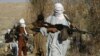 FILE - Armed Taliban fighters are seen at an unidentified location in Nangarhar province, Afghanistan, Dec.13, 2010. 