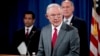 Attorney General Jeff Sessions, accompanied by, from left, National Counterintelligence and Security Center Director William Evanina, Director of National Intelligence Dan Coats, speaks during a briefing at the Justice Department in Washington, Aug. 4, 20