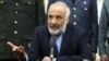 FILE - Masoom Stanikzai talks during a press conference at presidential palace in Kabul, Afghanistan. 