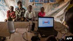 FILE - A group of children from South Kordofan, Sudan, wait to be registered as they arrive at a refugee settlement in Yida, South Sudan, on Jan. 25, 2016.
