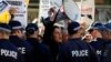 A man shouts slogans against the Australian Labor Party (ALP) during a rally in support of asylum seekers outside an ALP meeting in Sydney, July 22, 2013. 