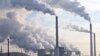 FILE - Steam and smoke is seen over the coal burning power plant in Gelsenkirchen, Germany.