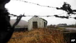 FILE - The old disused border post on the border between the Republic of Ireland and Northern Ireland near Jonesborough, Northern Ireland, Jan. 30, 2017.