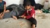 Child displaced by fighting in his village southeast of Mosul in Makhmour, Iraq, April 14, 2016, (S. Behn / VOA)
