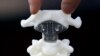 FILE - A spine model implanted with a 3D-printed artificial axis is displayed at Peking University Third Hospital in Beijing, China, Aug. 14, 2014. 
