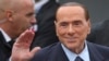 FILE - Opposition leader Silvio Berlusconi of Italy arrives for a meeting of the European People's Party prior to an EU summit in Brussels on Thursday, Oct. 19, 2017. 