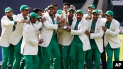 Pakistan players celebrate during the award ceremony for the ICC Champions Trophy at The Oval in London, Sunday, June 18, 2017. Pakistan won the final by crushing India for 180 runs. 