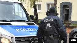 Policemen search an apartment building close to the mosque "Deutschsprachiger Islamkreis Hildesheim e.V." (German speaking Islam circle, DIK) in Hildesheim, central Germany, Nov. 8, 2016.