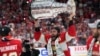 Florida Panthers defenseman Aaron Ekblad raises the NHL hockey Stanley Cup trophy after defeating the Edmonton Oilers in Game 7 of the Final, June 24, 2024, in Sunrise, Fla.